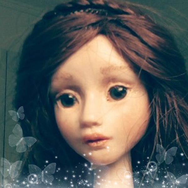 Sophija poseable doll from polymer clay with brown hair and eyes.